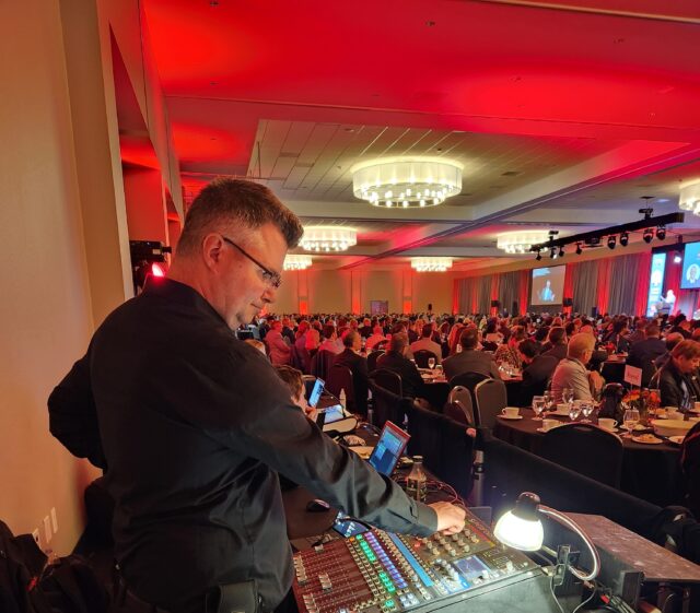 Mercury sound mixing in ballroom event.